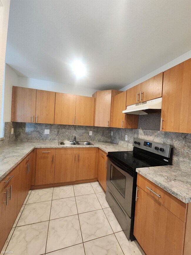 Building Photo - 4 br, 2 bath House - 7601 NW 20th Ave Exce...