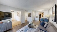 Located at 240 El Dorado Blvd in Houston, TX, this single-floor 2-bedroom, 1-bathroom home offers a thoughtfully arranged layout that maximizes every inch of its comfortable footprint. The open living and dining area serves as the heart of the home, featuring wood-style flooring, a textured ceiling, and a sliding glass door that fills the space with natural light and provides outdoor access. The galley-style kitchen is well-appointed with white shaker cabinetry, a gray subway tile backsplash, white countertops, and black appliances, offering ample storage and prep space. A dedicated laundry area adds everyday convenience. The spacious primary bedroom features plush carpeting, a ceiling fan, and a walk-in closet, creating a comfortable retreat. The second bedroom also offers carpeted floors, a ceiling fan, a large window, and closet space, making it equally versatile as a guest room or home office. The full bathroom is clean and functional, featuring a tub-shower combination, white cabinetry, and wood-style flooring. A hallway connects all rooms seamlessly, contributing to the home's efficient and cohesive flow. Neutral tones and consistent finishes throughout lend the space a modern, move-in-ready appeal.