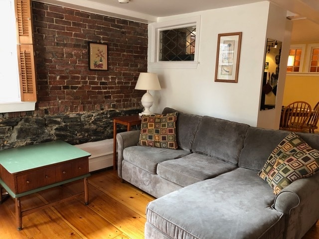 Wood floors, exposed brick, sectional couch - 2 Emmons Pl