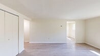 Located at 1260 Rossiter Ave in Baltimore, MD, this two-bedroom, one-bathroom unit offers a practical and well-maintained single-floor layout. The interior is finished with light-toned laminate flooring throughout the living areas and bedrooms, contributing to a bright and cohesive aesthetic. Neutral walls in warm off-white tones keep the space feeling open and easy to personalize.

The kitchen is efficiently designed and features warm honey-toned wood cabinetry extending to the upper walls for ample storage, granite-look countertops, a stainless steel sink, and white appliances including a refrigerator, gas range, and dishwasher. Flush ceiling lighting provides even illumination throughout.

The spacious primary bedroom includes a built-in closet with bifold doors and a window that allows natural light to filter in. The second bedroom is a well-proportioned room with laminate flooring and clean walls. Both rooms connect via hallways that guide the flow of the unit.

The bathroom is finished with light tile flooring, a full tub-shower combo with white tile surround, a wood-toned vanity with a white countertop, and clean, simple fixtures. The overall design is functional and move-in ready, making it a practical option in the Northeast Baltimore area.
