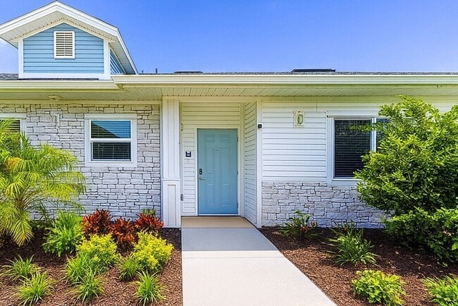 Lovely private entries with lush landscaping - Viva Palm Coast