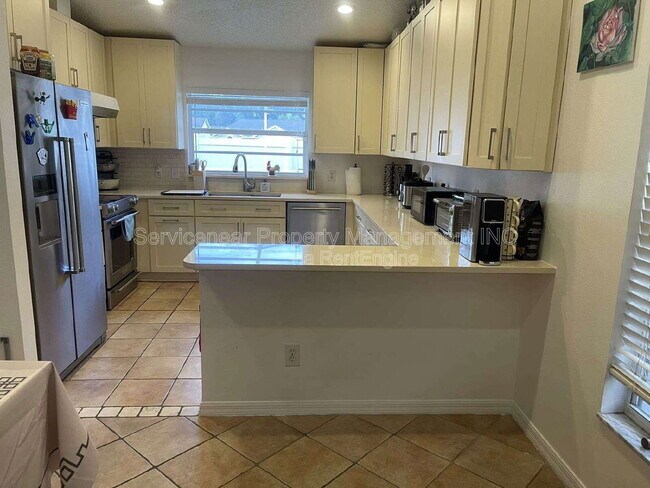 Foto del edificio - 9727 Cypress Shadow Ave