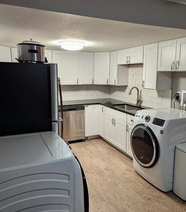 Photo - Beautifully Renovated 3 Bedroom Apartment with Private Balcony, In-Unit Laundry & A/C