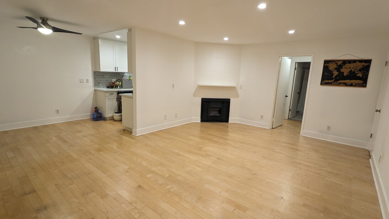 Entry way, living room, fireplace, dinning room. - 3131 S Canfield Ave