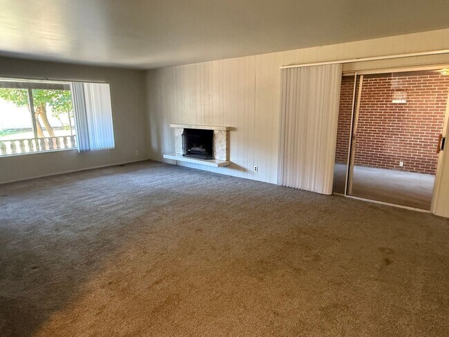Building Photo - Beautiful town home with deep 2 car garage and a large covered patio