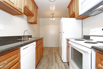Stove, Microwave, Refrigerator and Dishwasher - Castlewood Apartments