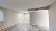Located at 482 E Blackstock Rd in Spartanburg, SC, this single-story, 2-bedroom, 1-bathroom home offers a clean and updated interior with a cohesive neutral color palette throughout. Light-toned luxury vinyl plank flooring runs continuously through the living areas and bedrooms, creating a bright, unified feel. The open living room features textured ceilings, recessed lighting, and natural light from multiple windows with blinds. A structural soffit detail with ceiling-mounted HVAC vents adds an architectural element to the shared living space. The kitchen is well-appointed with white shaker-style cabinetry, light quartz countertops, a stainless steel double-basin sink, and stainless steel appliances including a gas range and dishwasher — all set against light flooring for a clean, modern aesthetic. The spacious primary bedroom receives generous natural light through a large window and connects to dedicated closet space. The secondary bedroom also features natural light and its own closet with a hanging rod. Both bedrooms offer neutral walls and matching LVP flooring. The full bathroom includes a tub-shower combo, a vanity with white cabinetry, and wood-toned flooring. The home's consistent finishes and functional layout make it a practical and move-in ready residence.