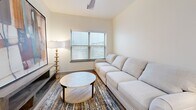 This well-appointed two-bedroom, two-bathroom home in Bixby, Oklahoma offers a thoughtfully designed single-level layout with modern finishes throughout. The kitchen is a standout feature, showcasing slate-blue shaker cabinetry, white quartz countertops, a classic subway tile backsplash, stainless steel appliances, and a central island with bar seating — all illuminated by recessed lighting and stylish pendant fixtures. Light wood-tone flooring flows seamlessly through the main living areas, enhancing the bright, open atmosphere. The living room is a comfortable retreat with a ceiling fan, a large window that invites natural light, and ample space for relaxing. The primary bedroom features plush carpeting, a ceiling fan, and direct access to a dedicated en-suite bathroom complete with a dual-sink vanity with backlit mirrors, gray cabinetry, and white quartz countertops. The second bathroom offers a soaking tub with elegant marble-style tile surround. Both bedrooms are served by well-organized closets with built-in shelving and hanging space. A dedicated laundry room houses a full-size side-by-side washer and dryer with overhead shelving, adding everyday convenience to this polished and functional home.