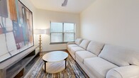 This well-appointed two-bedroom, two-bathroom home in Bixby, Oklahoma offers a thoughtfully designed single-level layout with modern finishes throughout. The kitchen is a standout feature, showcasing slate-blue shaker cabinetry, white quartz countertops, a classic subway tile backsplash, stainless steel appliances, and a central island with bar seating — all illuminated by recessed lighting and stylish pendant fixtures. Light wood-tone flooring flows seamlessly through the main living areas, enhancing the bright, open atmosphere. The living room is a comfortable retreat with a ceiling fan, a large window that invites natural light, and ample space for relaxing. The primary bedroom features plush carpeting, a ceiling fan, and direct access to a dedicated en-suite bathroom complete with a dual-sink vanity with backlit mirrors, gray cabinetry, and white quartz countertops. The second bathroom offers a soaking tub with elegant marble-style tile surround. Both bedrooms are served by well-organized closets with built-in shelving and hanging space. A dedicated laundry room houses a full-size side-by-side washer and dryer with overhead shelving, adding everyday convenience to this polished and functional home.