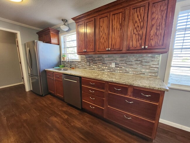 Building Photo - Available Now, PG 4 Bedroom