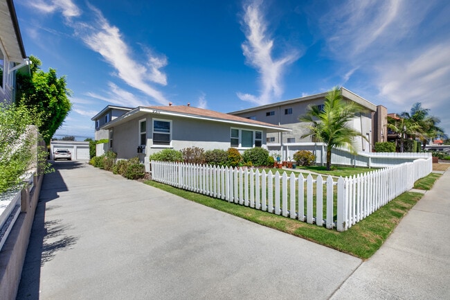 Property street view and driveway - 2211 Nelson Ave