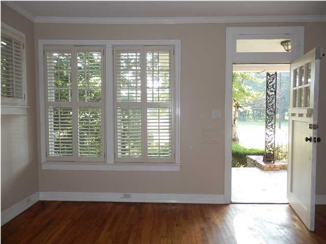 Living room facing front door/plantation shutters - 119 Tuscaloosa St