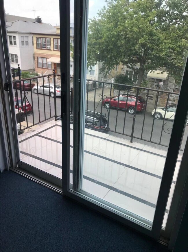 Private balcony with sliding door entrance in living room - 1758 80th St