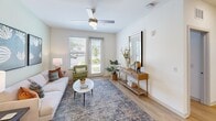 Located at 480 John Carter Rd in Savannah, GA, this thoughtfully designed one-bedroom, one-bathroom residence offers a comfortable and modern living experience across a single floor. Light-toned hardwood-style flooring flows seamlessly throughout, tying the open-concept layout together with a clean, cohesive aesthetic.

The kitchen is a standout feature, showcasing white shaker cabinetry, granite countertops, a classic subway tile backsplash, and a full suite of stainless steel appliances. A central island with bar seating provides additional prep space and casual dining options, while recessed lighting enhances the bright atmosphere.

The living room is inviting and well-lit, featuring large windows that welcome natural light and a ceiling fan overhead. The space opens comfortably for both relaxing and entertaining.

The bedroom is a serene retreat, offering ample space, large windows with outdoor views, a ceiling fan, and a dedicated closet for storage. The calm, neutral palette contributes to a restful ambiance.

The bathroom features white cabinetry, granite countertops, an undermount sink, and a marble-tiled shower surround, delivering a clean and polished finish.

A dedicated laundry room with a full-size washer and dryer adds a practical and convenient touch to complete this well-rounded residence.