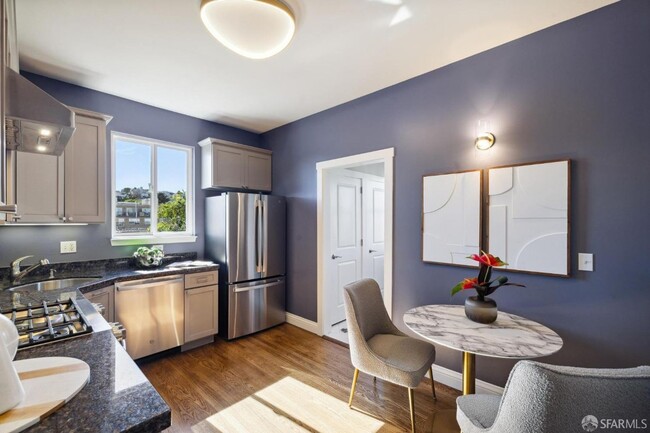 Building Photo - SWANKY EDWARDIAN TOP-FLOOR CONDO WITH STUN...