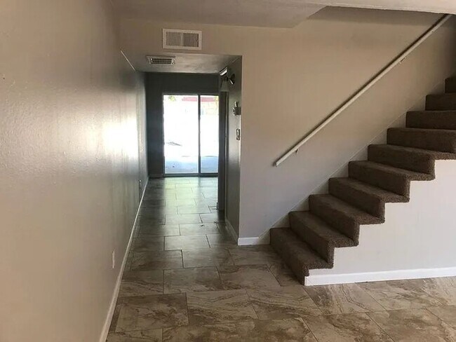 Building Photo - SPACIOUS AND AFFORDABLE 3 BEDROOM, 1.5 BATH TOWNHOME READY FOR IMMEDIATE MOVE-IN!