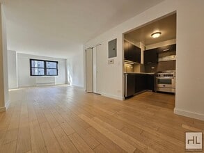 Building Photo - High-Floor One-Bedroom with 1.5 Baths and In-Unit Laundry Near the UN