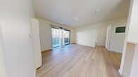Located at 3761 Harrison Street in Oakland's Temescal neighborhood, this thoughtfully updated single-floor unit offers a clean, modern aesthetic throughout. Light-toned wood flooring flows seamlessly across the entire space, creating a cohesive and airy feel.

The main living area is bright and open, benefiting from a sliding glass door that leads to a private balcony, allowing natural light to fill the room. Vertical blinds offer flexible light control. A wall-mounted heating unit provides efficient climate management.

The galley-style kitchen is well-appointed with white shaker cabinetry, sleek silver hardware, light quartz countertops, and a full suite of stainless steel appliances including a gas range, microwave, refrigerator, and dishwasher.

The bedroom is a calm, neutrally finished space with a large window overlooking the exterior and a full-width mirrored sliding closet that enhances the sense of space. The bathroom features a tub-shower combination enclosed by glass sliding doors, with elegant marble-patterned tile surround lending a refined touch.

Overall, the unit presents a fresh, minimalist design with quality finishes, balcony access, and a functional layout suited to comfortable urban living in Oakland.