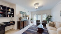 Located at 3600 Winthrop Dr in Lexington, Kentucky, this single-floor residence offers a well-appointed layout designed for comfortable living. The living room is a welcoming focal point, featuring crown molding, plush carpeting, and generous natural light streaming through French doors that open to an outdoor view. The space is thoughtfully designed with a ceiling fan fixture, neutral walls, and room for a variety of furnishing arrangements.

The kitchen is both functional and stylish, showcasing warm wood cabinetry, granite countertops, a tile backsplash, and stainless steel appliances including a refrigerator, range, and microwave. A central island with pendant lighting provides additional prep space and casual seating, while an adjacent dining area completes the open-concept layout.

The bedrooms are bright and comfortable, each featuring plush carpet, neutral tones, and windows that allow in natural light. The bathrooms are finished with warm wood vanities, granite countertops, tile flooring, and framed mirrors. One bathroom includes a glass-enclosed walk-in shower, while another features a single vanity with a large mirror and bright overhead lighting.

A dedicated in-unit laundry room with washer and dryer hookups and overhead shelving adds everyday convenience. Overall, this residence offers a cohesive and practical living environment.