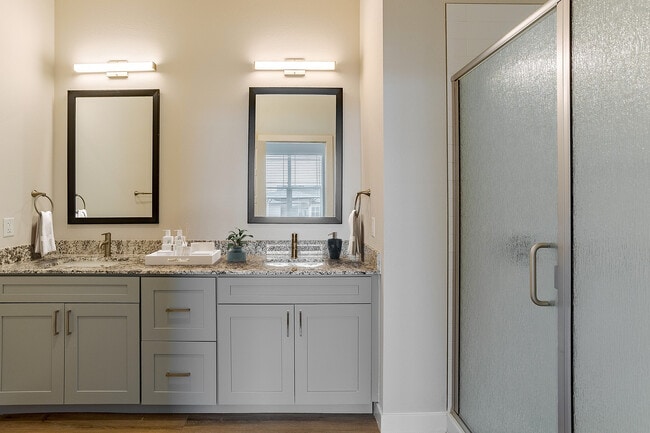 Bathroom with Double Sink Vanity & Shower - Destination at Arista Apartments