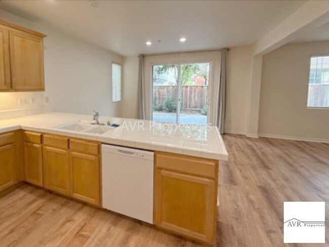 Building Photo - Spacious home with a large open concept kitchen, dining and living room