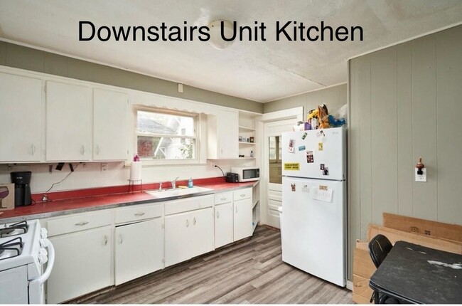 Spacious kitchen with fridge, stove and attached back porch - 52 Corson Ave