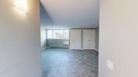 Located at 1 White Pine Cir in Fairport, NY, this two-story home offers a practical and well-organized layout spread across two floors. The main level features a spacious living room with neutral-toned carpeting, a baseboard heating system, and a large window that fills the area with natural light, creating a bright and welcoming atmosphere. The entry level also includes a hallway connecting the key living areas, as well as access to a staircase leading to the upper floor.

Upstairs, two carpeted bedrooms provide comfortable retreats, each featuring neutral wall tones and white trim throughout. Both bedrooms are equipped with full-width bi-fold closets offering generous storage. The primary bedroom is well-sized and benefits from natural light through a window with outdoor views. The second bedroom similarly features a window and closet, contributing to a consistent and clean aesthetic across both rooms.

The single full bathroom is finished in white, featuring a combination tub and shower unit with chrome fixtures and built-in corner shelving, maintaining a clean and functional design. Throughout the home, the consistent use of neutral tones, plush carpeting, and baseboard heating creates a cohesive, low-maintenance living environment suited for comfortable everyday living in the Fairport community.