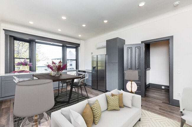 Kitchen with high end appliances and huge bay window. - 728 E McMillan St