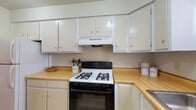 Located at 440 Alexandria Colony Ct W in Columbus, Ohio, this two-floor residence offers a practical and straightforward layout designed for comfortable everyday living. The kitchen is equipped with white cabinetry extending to the upper walls, warm wood-toned countertops, a gas range with overhead ventilation, and tile flooring — providing ample workspace and storage for cooking needs.

The main living area is generously sized, featuring neutral wall-to-wall carpeting and a ceiling fan with integrated lighting. A sliding glass door fills the space with natural light and provides direct access to an outdoor area, making it a bright and versatile room. Louvered and standard interior doors add architectural character and offer access to additional storage.

The bedrooms are carpeted and well-proportioned, each featuring windows with blinds that allow natural light and outdoor views. Sliding closets provide organized storage within the rooms. The bathrooms are functional in design, with tiled surfaces, a shower with curtain, vanity with countertop, and chrome fixtures. The two-floor configuration allows for clear separation between living and private spaces, contributing to an organized and livable overall layout throughout the home.