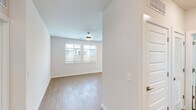 Located in Garland, TX, this well-appointed single-story, 2-bedroom, 2-bathroom home blends modern finishes with a clean, functional layout. Warm wood-look flooring flows consistently throughout the entire space, creating a cohesive and inviting atmosphere.

The open-concept kitchen and living area serves as the heart of the home. The kitchen is outfitted with stainless steel appliances, including a refrigerator, range, microwave, and dishwasher, complemented by two-tone cabinetry, a classic subway tile backsplash, granite countertops, and a central island — ideal for casual dining or food preparation. Recessed lighting illuminates the space, which also benefits from natural light through the windows.

The spacious primary bedroom features a ceiling fan and direct access to a well-organized walk-in closet with built-in shelving and dual hanging rods. Its en-suite bathroom is finished with granite countertops, a single-sink vanity with ample drawer storage, and a glass-enclosed walk-in shower with subway tile surround. A bright window provides natural light.

The second bedroom is generously sized with dual windows, a ceiling fan, and plentiful natural light. Both bedrooms offer a bright, airy feel with neutral wall tones that enhance the clean aesthetic throughout this move-in-ready home.