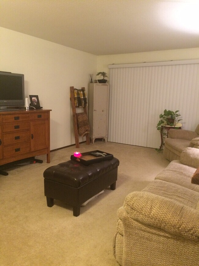 Open and inviting living room with walkout to a beautiful three season porch. - 132 Demont Ave. East