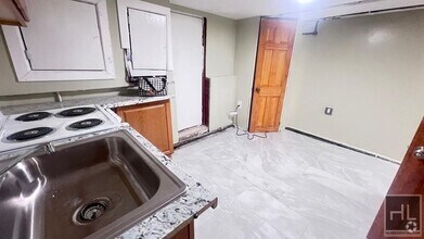 Building Photo - FRESHLY RENOVATED  2 BEDROOMS SEMI- BASEME...