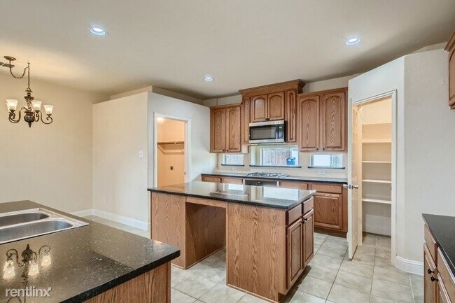 Foto del edificio - 4 br, 4 bath House - 1707 Teakwood Drive UNIT