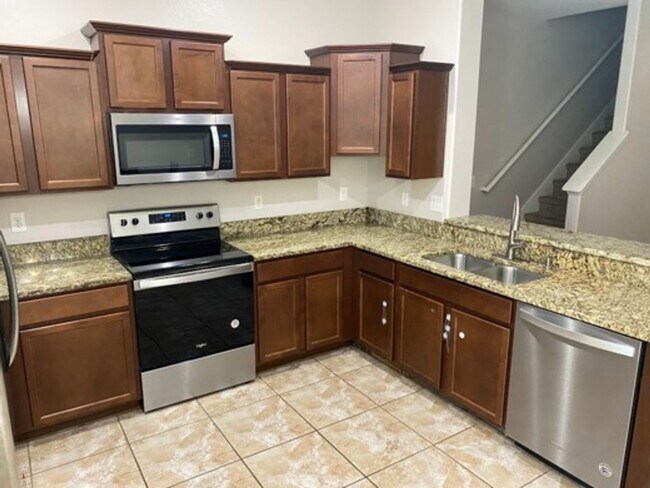 Building Photo - This beautiful townhome in nice gated comm...