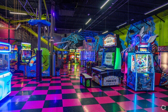 Arcade and high climbing area of Flying Squirrel Trampoline Park.