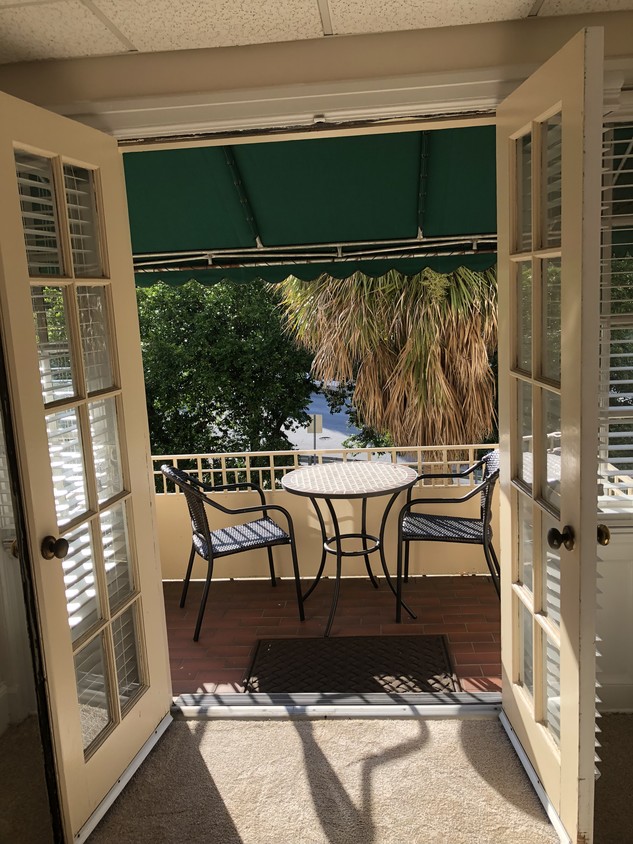 French doors lead to balcony in the trees. - 2068 Walton Way