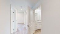 Located at 327 E Fountain Blvd in Colorado Springs, Colorado, this efficiently designed two-bedroom, one-bathroom residence offers a clean, modern aesthetic throughout its single-floor layout. Light wood-style flooring runs through the main living areas and kitchen, creating a cohesive and bright atmosphere.

The kitchen is outfitted with stainless steel appliances — including a refrigerator, range, microwave, and dishwasher — paired with white shaker-style cabinetry and recessed lighting overhead. The open design allows the kitchen to connect naturally to the surrounding living space.

Two connecting hallways lead to the bedrooms and bathroom, maintaining an organized and functional flow. Both bedrooms feature plush neutral carpeting and individual windows that invite natural light and offer views of surrounding greenery. The primary bedroom provides a comfortable, well-proportioned space.

The full bathroom is finished with white cabinetry, a stone-topped vanity with an integrated sink, a large mirror with overhead lighting, and a full tub-shower combination with chrome fixtures — all presented in a clean, minimalist style.

Throughout the residence, white walls, light flooring, and consistent trim work contribute to a bright, modern ambiance. The space is thoughtfully laid out to maximize functionality, making it a practical and well-appointed home in the heart of Colorado Springs.