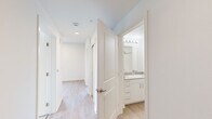 Located at 327 E Fountain Blvd in Colorado Springs, Colorado, this efficiently designed two-bedroom, one-bathroom residence offers a clean, modern aesthetic throughout its single-floor layout. Light wood-style flooring runs through the main living areas and kitchen, creating a cohesive and bright atmosphere.

The kitchen is outfitted with stainless steel appliances — including a refrigerator, range, microwave, and dishwasher — paired with white shaker-style cabinetry and recessed lighting overhead. The open design allows the kitchen to connect naturally to the surrounding living space.

Two connecting hallways lead to the bedrooms and bathroom, maintaining an organized and functional flow. Both bedrooms feature plush neutral carpeting and individual windows that invite natural light and offer views of surrounding greenery. The primary bedroom provides a comfortable, well-proportioned space.

The full bathroom is finished with white cabinetry, a stone-topped vanity with an integrated sink, a large mirror with overhead lighting, and a full tub-shower combination with chrome fixtures — all presented in a clean, minimalist style.

Throughout the residence, white walls, light flooring, and consistent trim work contribute to a bright, modern ambiance. The space is thoughtfully laid out to maximize functionality, making it a practical and well-appointed home in the heart of Colorado Springs.