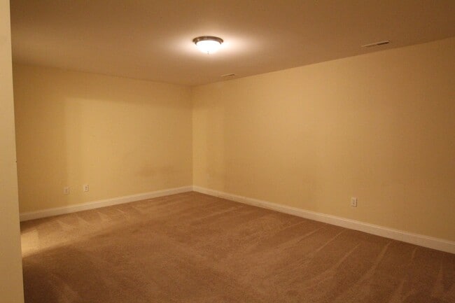 Photo - Spacious 3 Bedroom, 3.5 Bathroom Townhome with Finished Basement, Fenced Yard & Garage