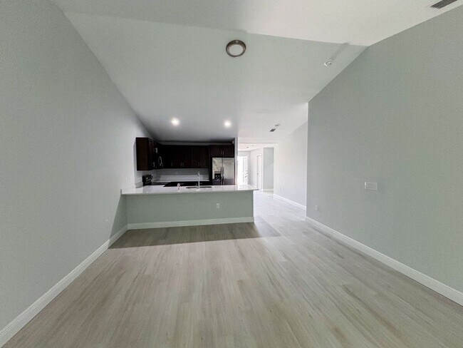 Building Photo - AMAZING OPPORTUNITY! This spacious duplex offers 3 bedrooms, 2 bathrooms, and a 1-car garage