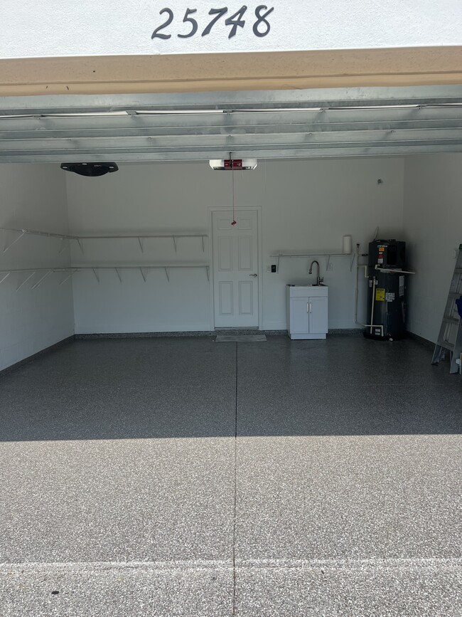 2 Car Garage. Flaked floors. - 25748 Grayton Ave