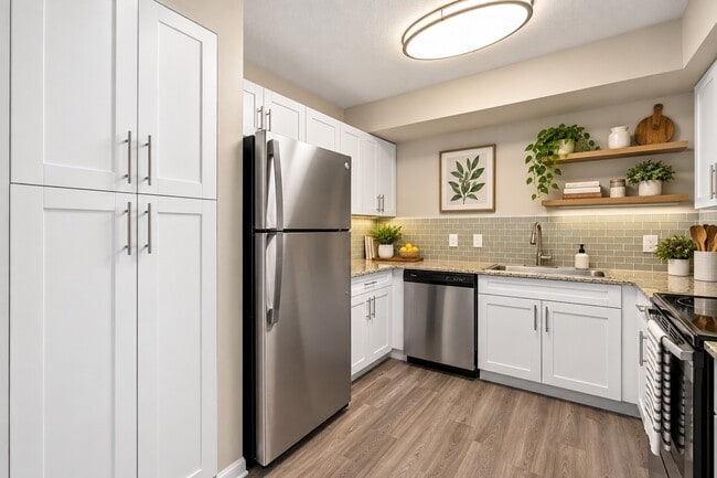 Elevate your culinary experience in the stylish kitchen of Club Mira Lago, featuring modern appliances and sleek finishes that inspire creativity. Transform meal prep into a pleasure. Explore your new home today! - Club Mira Lago Apartments