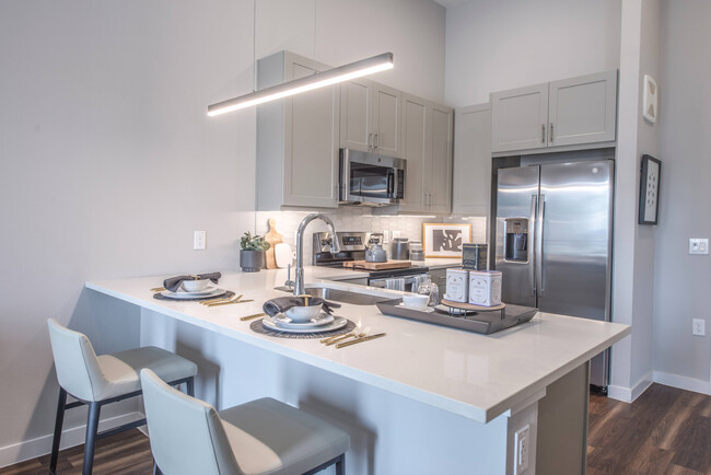 Beautiful Modern Kitchen with Bar - The Grand at Hill Street