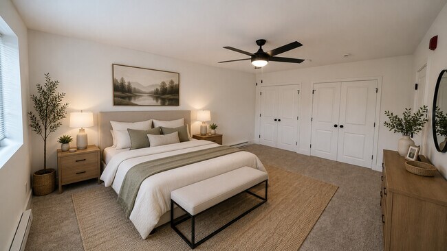 Furnished Master Bedroom with dual closets and ceiling fan - Southgate Gardens Apartments