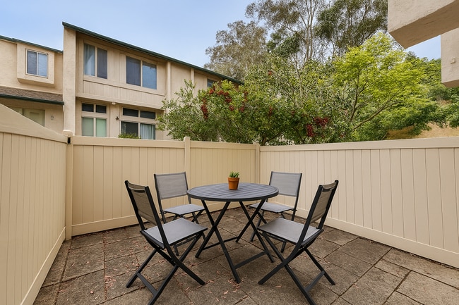 Building Photo - Move in Ready! 2BD Townhome! New Carpet! Two Patio Spaces! Attached Garage!