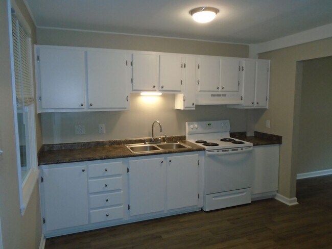 Building Photo - This two bedroom one bath duplex is centrally located. Just minutes to area bases, beaches, shopp...