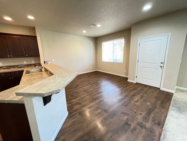 Building Photo - Spacious 4-Bedroom Home with Inviting Curb...