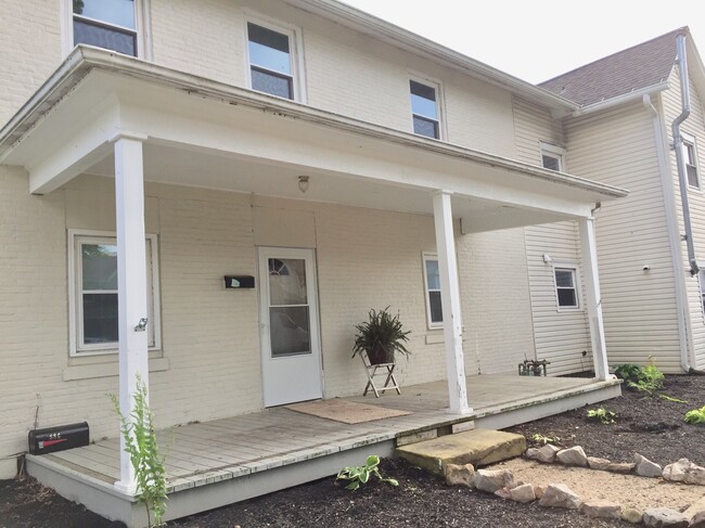 Front view of this historic home on a quiet street near the hospital and shopping. - 886 1/2 E Mulberry St