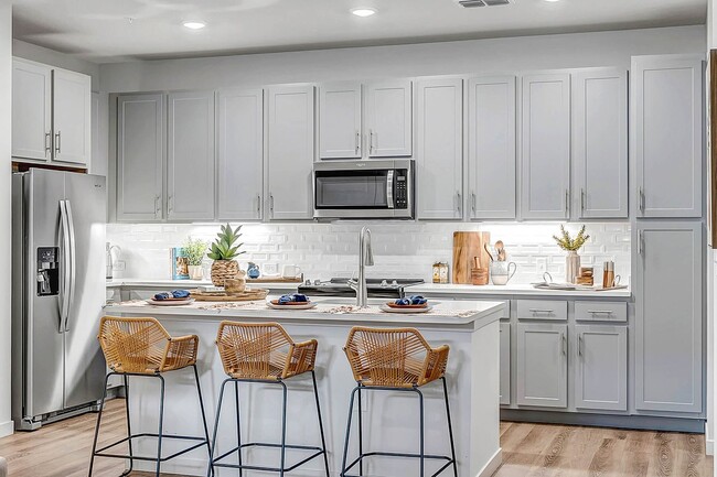 kitchen featuring a kitchen bar - The Grove at Clermont