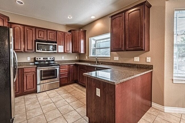 Photo - Stunning 5BR Home with Luxury Master Suite & Low-Maintenance Yard!